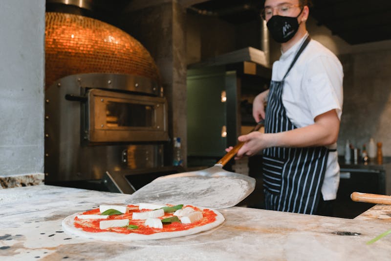 Marcos open kitchen where pizza is crafted fresh daily